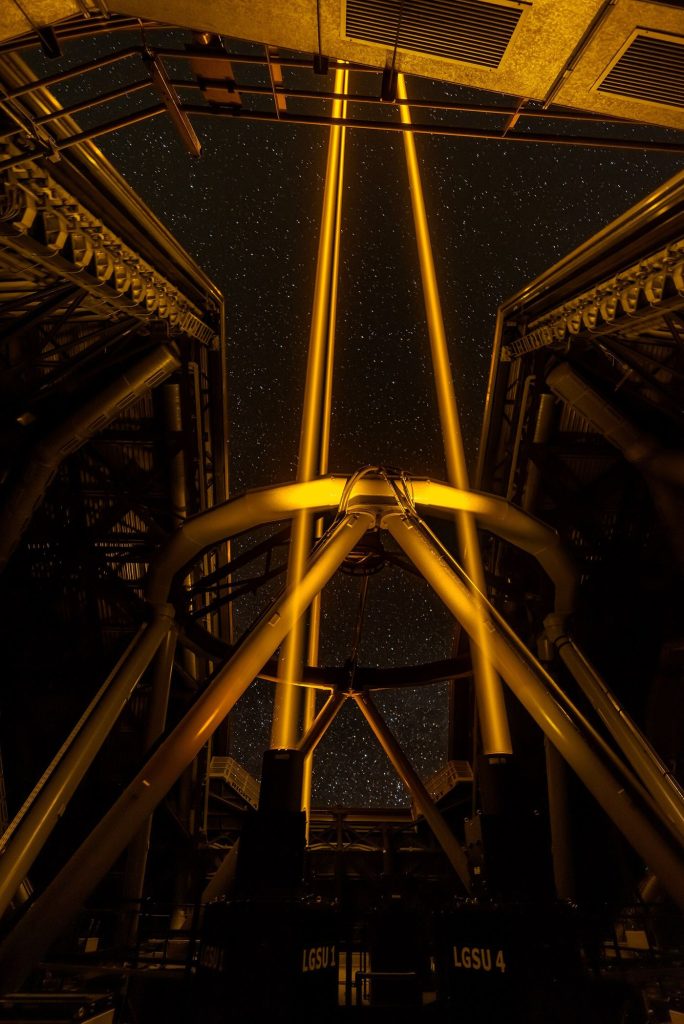 A telescope under a starry sky